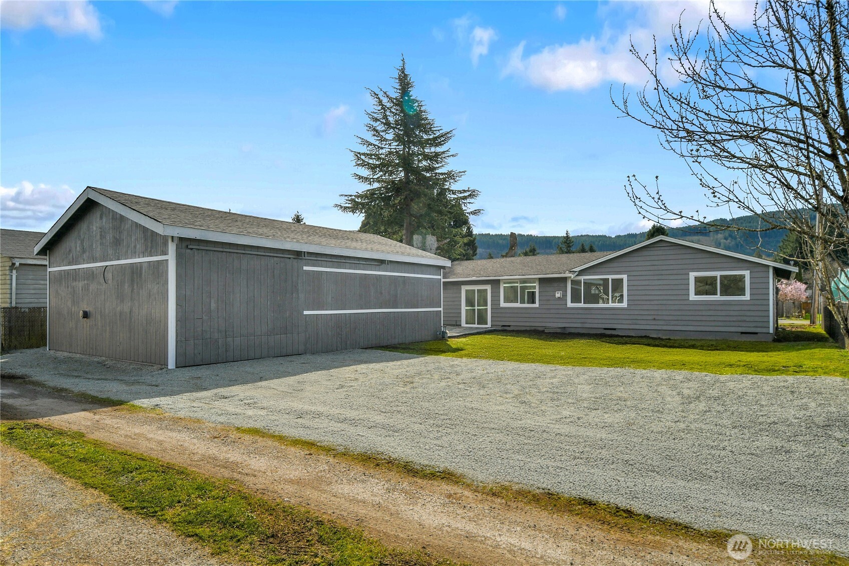 1006 Fidalgo Street Sedro-Woolley, WA 98284 - Photo 20 of 20 a front view of a house with a yard