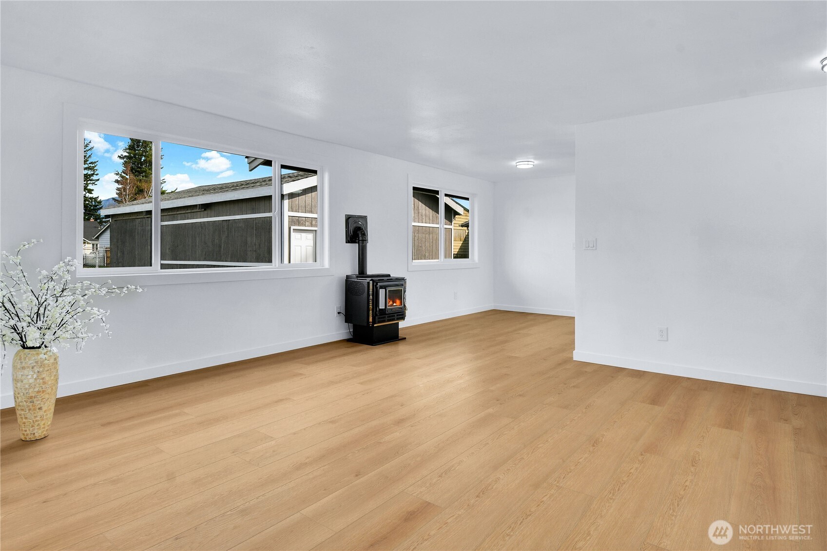 1006 Fidalgo Street Sedro-Woolley, WA 98284 - Photo 4 of 20 a view of empty room with wooden floor and fan