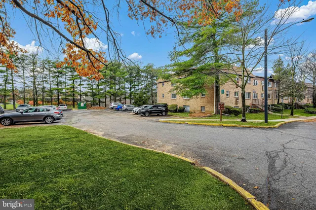 a view of street with parked cars
