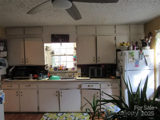 a bedroom with a bed and a potted plant