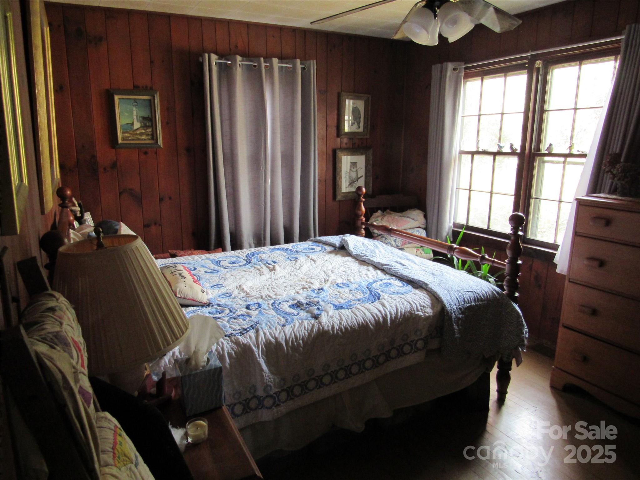 1144 Montreat Road Black Mountain, NC 28711 - Photo 24 of 30 a bedroom with a bed next to a window