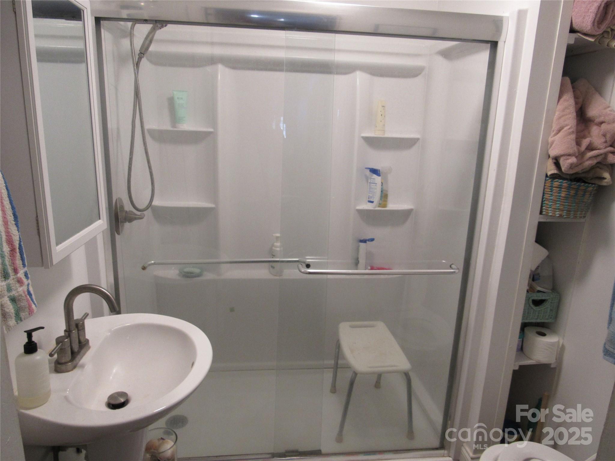 1144 Montreat Road Black Mountain, NC 28711 - Photo 26 of 30 a bathroom with a sink and mirror