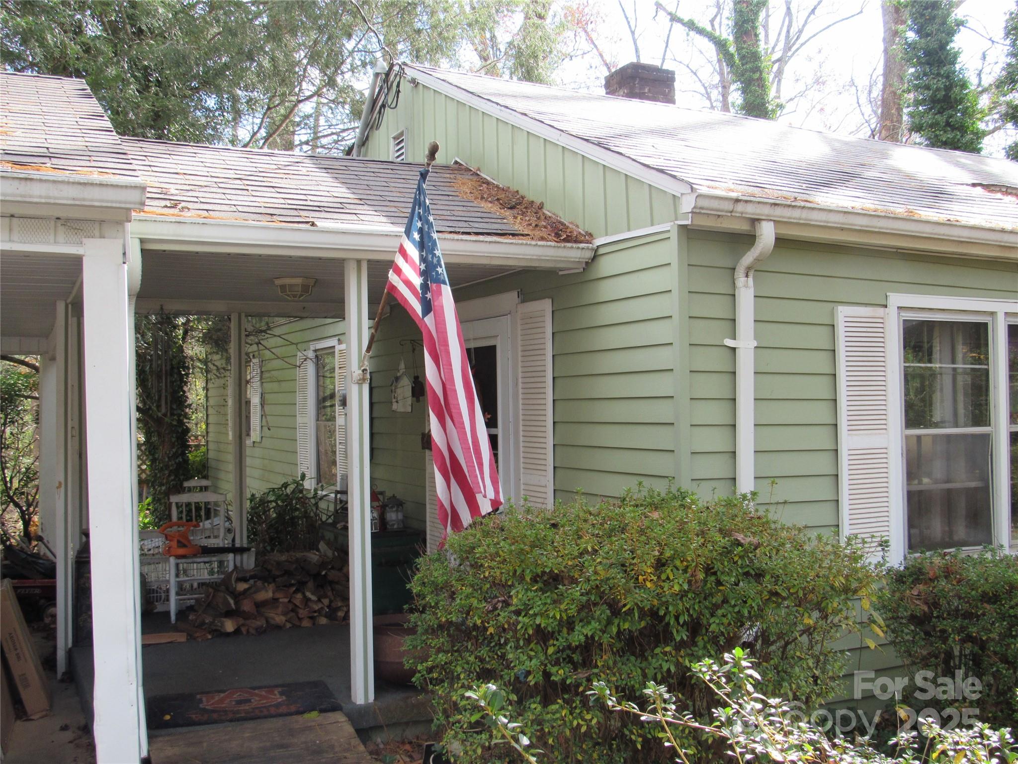 1144 Montreat Road Black Mountain, NC 28711 - Photo 3 of 30 a view of small white building with large windows