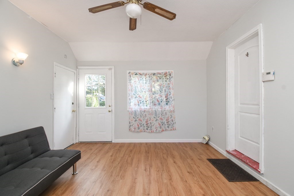 70 Intervale Road Springfield, MA 01118 - Photo 17 of 39 wooden floor in an empty room with a window
