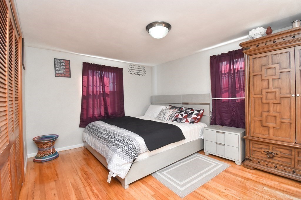 70 Intervale Road Springfield, MA 01118 - Photo 18 of 39 a bedroom with a bed and wooden floor