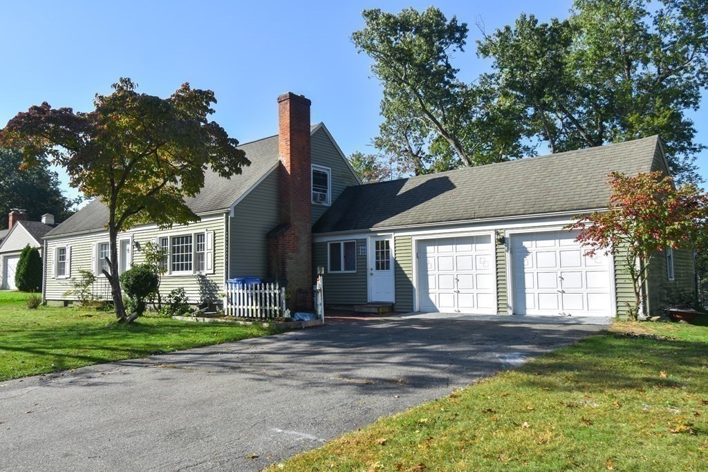 70 Intervale Road Springfield, MA 01118 - Photo 2 of 39 a front view of a house with a garden and trees
