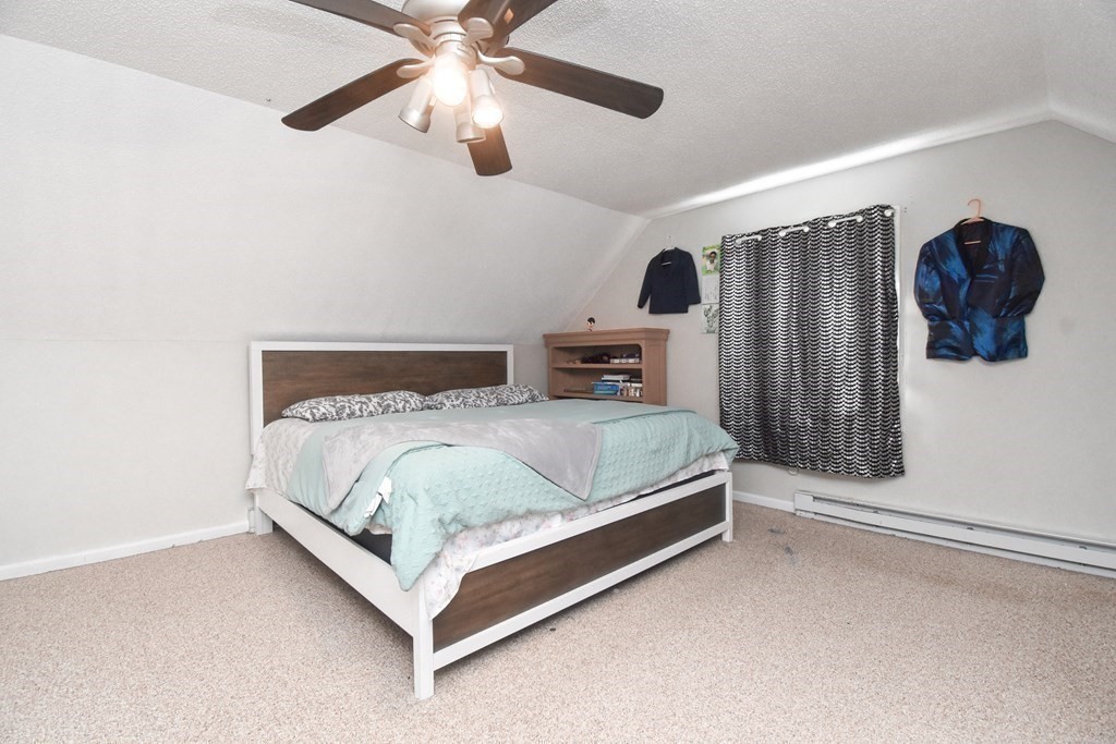70 Intervale Road Springfield, MA 01118 - Photo 23 of 39 a bedroom with a bed lamp and a large window