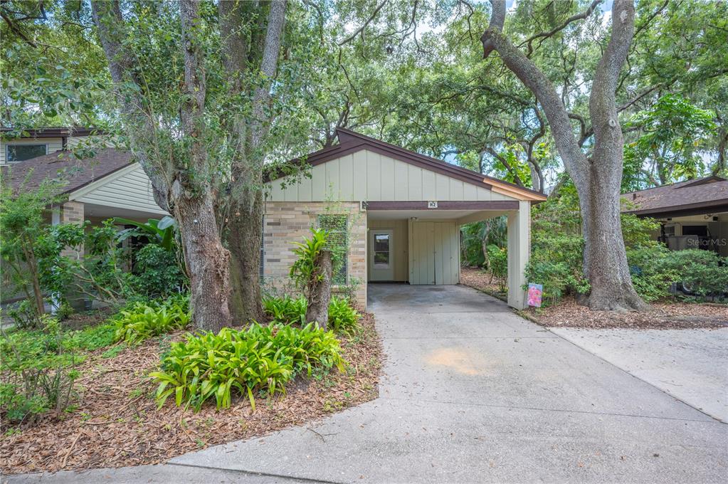 141 Fernery Road, Unit H2 Lakeland, FL 33809 - Photo 1 of 1 a front view of a house with garden