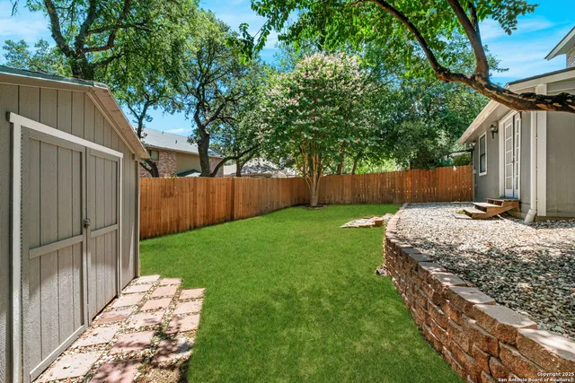 a view of backyard with green space