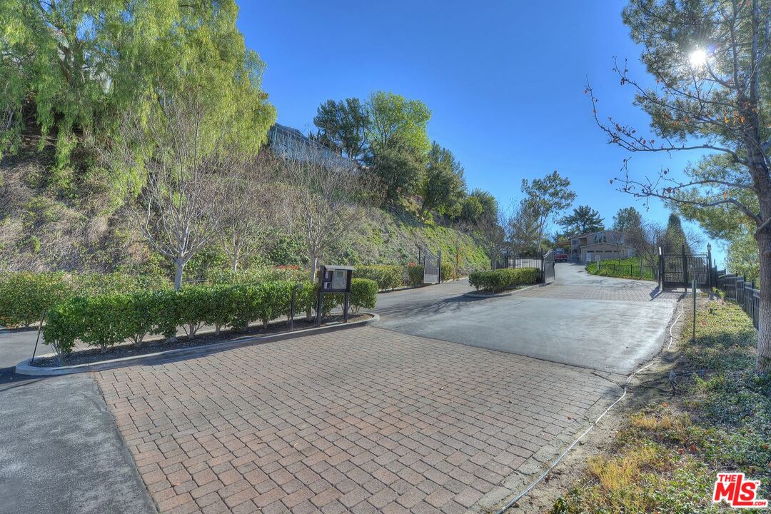 1165 Cherokee Topanga, CA 90290 - Photo 14 of 18 a view of a road with a yard