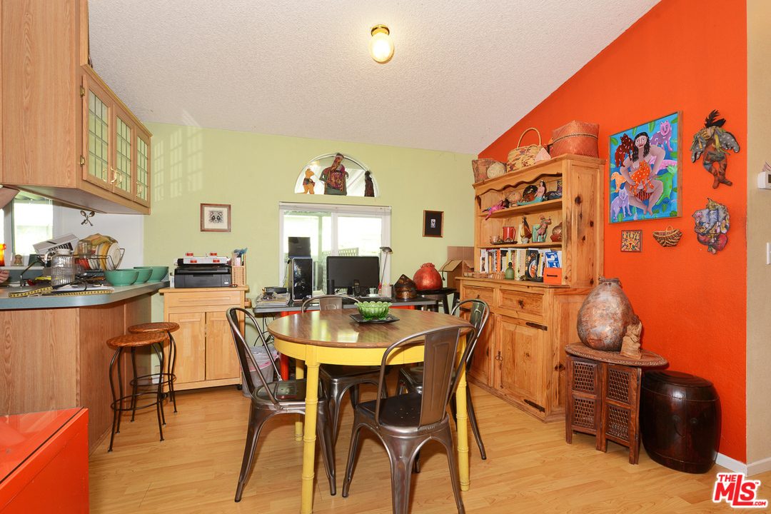 1165 Cherokee Topanga, CA 90290 - Photo 5 of 18 a view of a dining room with furniture and chandelier