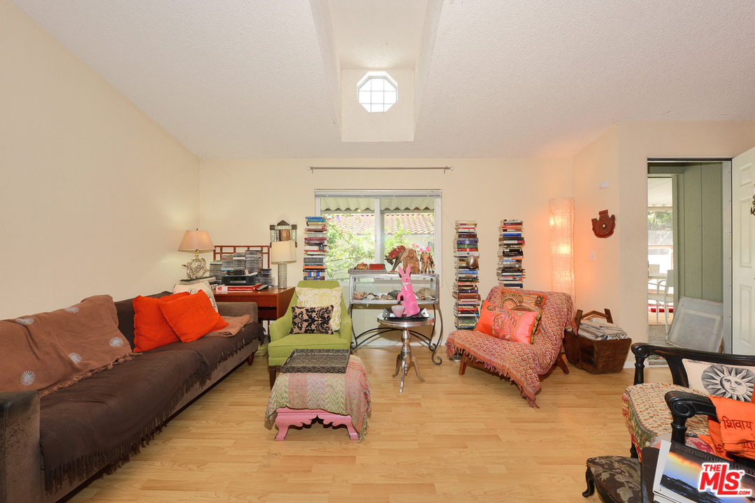 1165 Cherokee Topanga, CA 90290 - Photo 7 of 18 a living room with furniture and a large window