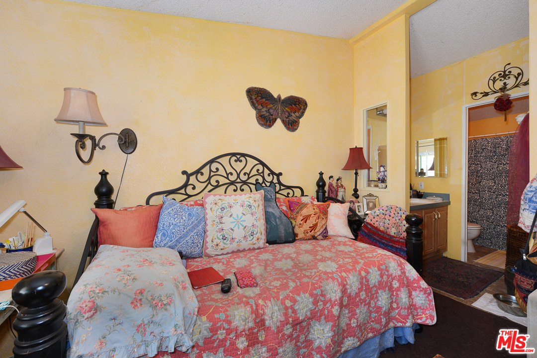 1165 Cherokee Topanga, CA 90290 - Photo 8 of 18 a bedroom with bed and a window