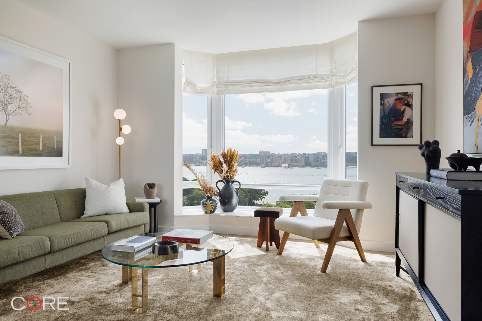 555 West 22nd Street, Unit 11AW Manhattan, NY 10011 - Photo 10 of 15 a living room with furniture and a large window
