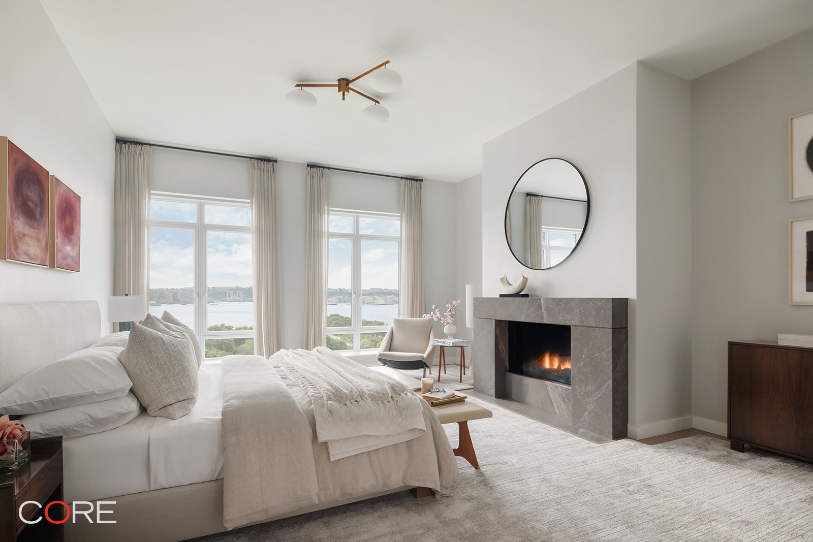 555 West 22nd Street, Unit 11AW Manhattan, NY 10011 - Photo 7 of 15 a bedroom with a bed and a fireplace