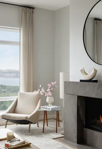 a view of a livingroom with furniture and a fireplace