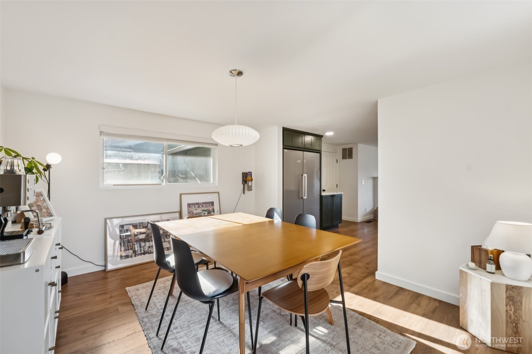 16602 126th Avenue Southeast Renton, WA 98058 - Photo 11 of 30 a view of a dining room with furniture and wooden floor