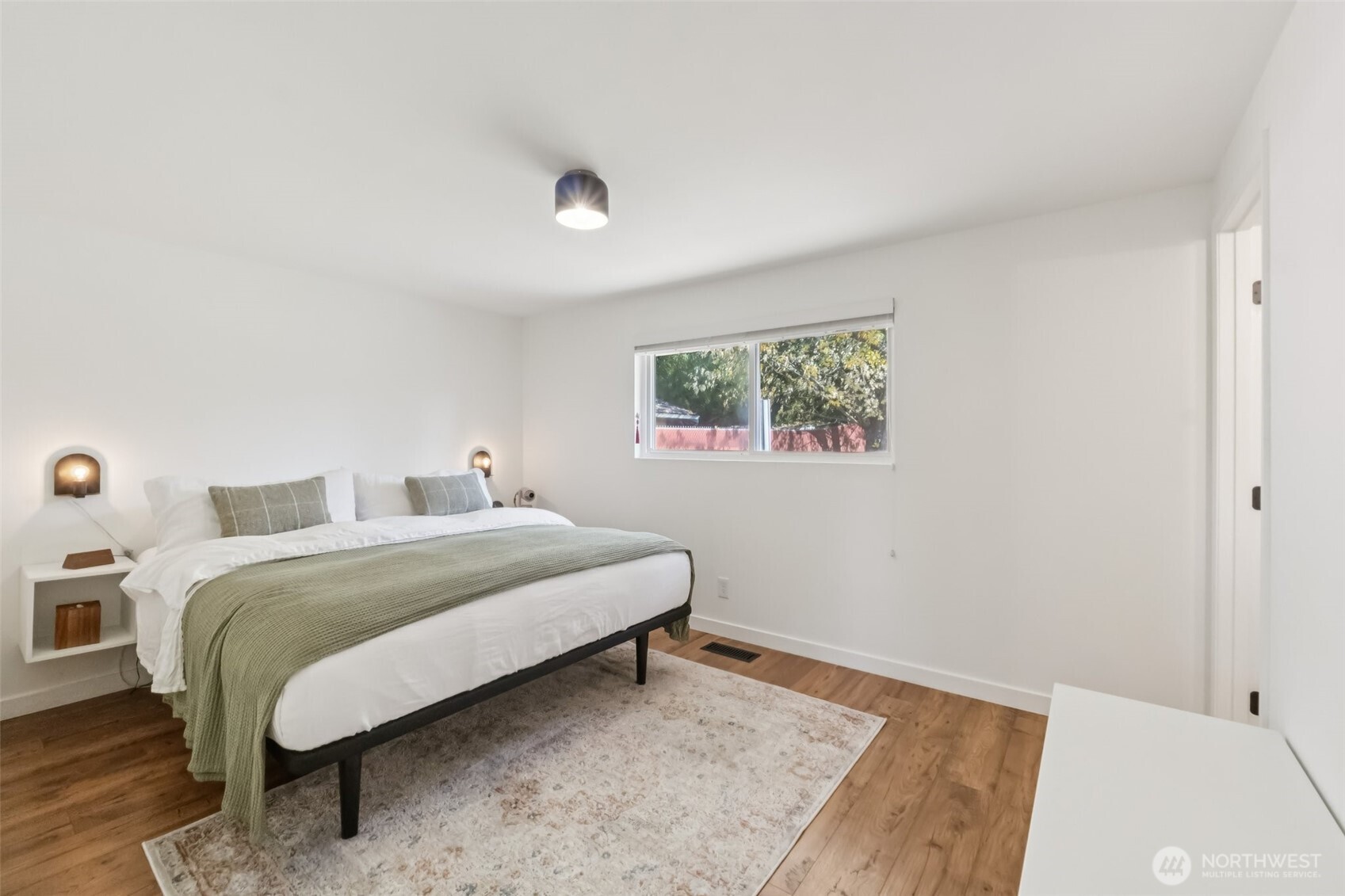 16602 126th Avenue Southeast Renton, WA 98058 - Photo 13 of 30 a bedroom with a bed and a couch