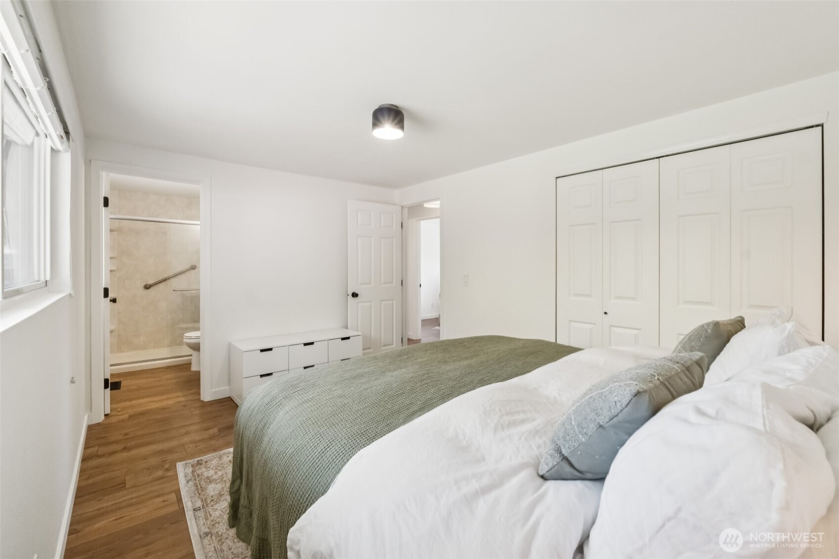 16602 126th Avenue Southeast Renton, WA 98058 - Photo 15 of 30 a bedroom with a bed and hallway