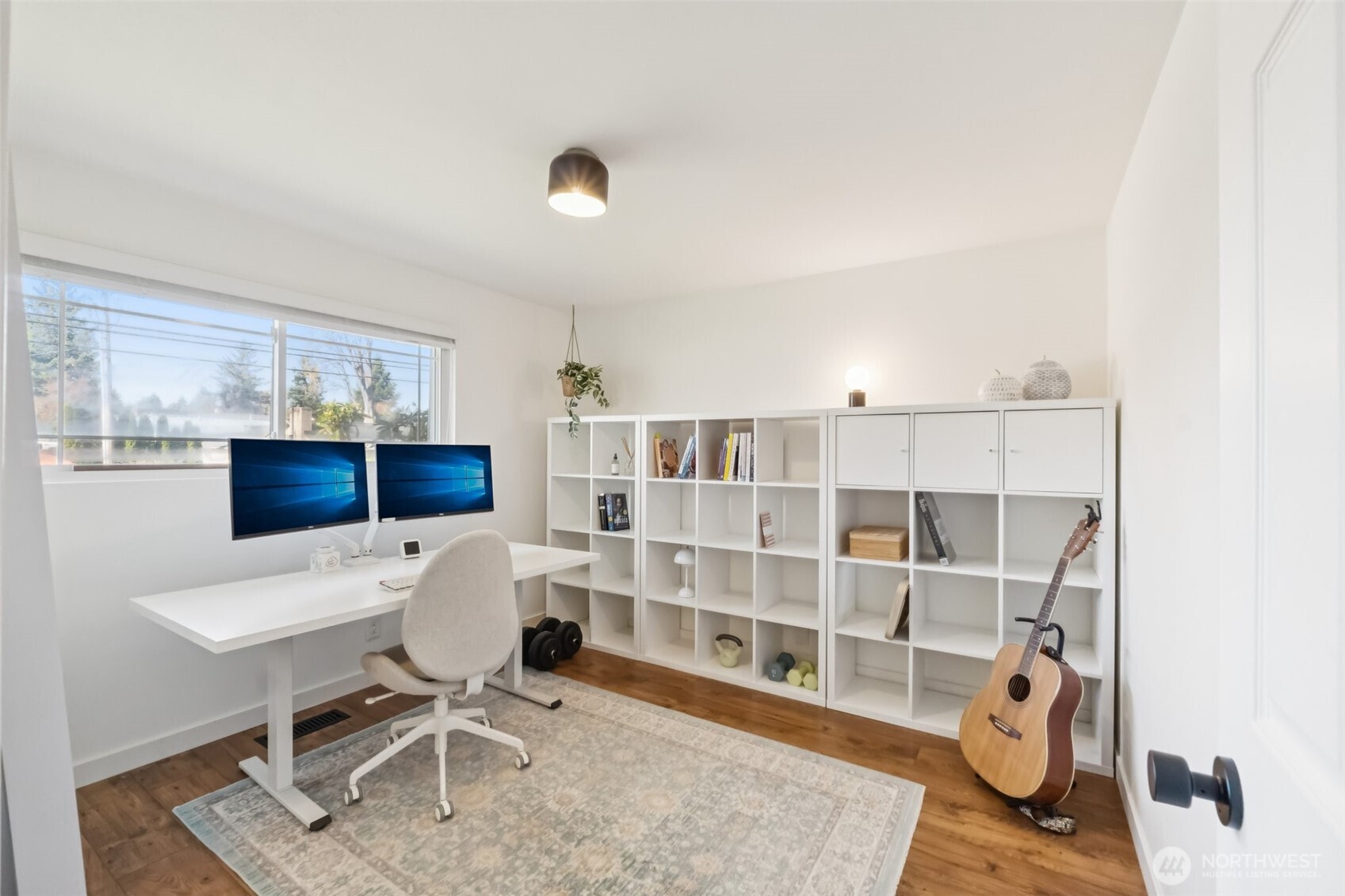 16602 126th Avenue Southeast Renton, WA 98058 - Photo 17 of 30 a workspace with furniture wall paintings and a window