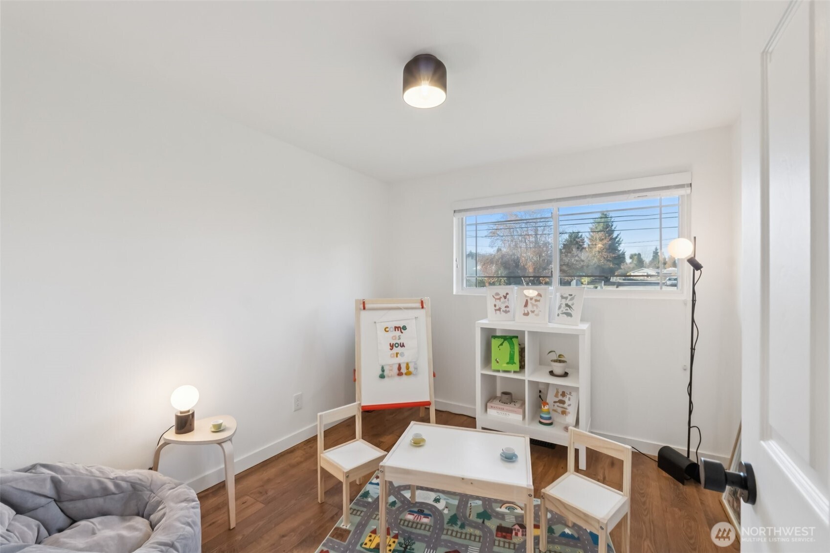 16602 126th Avenue Southeast Renton, WA 98058 - Photo 19 of 30 a living room with furniture and a window