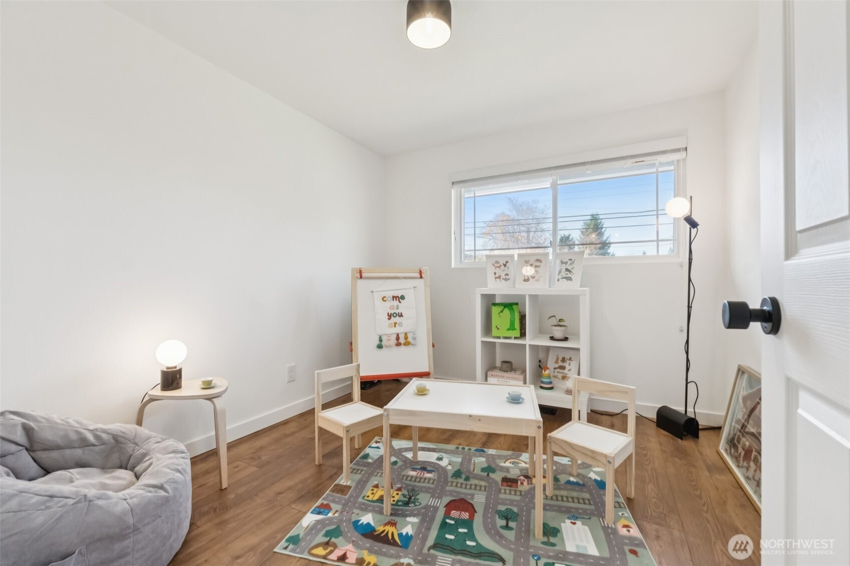 16602 126th Avenue Southeast Renton, WA 98058 - Photo 20 of 30 a living room with furniture and a window