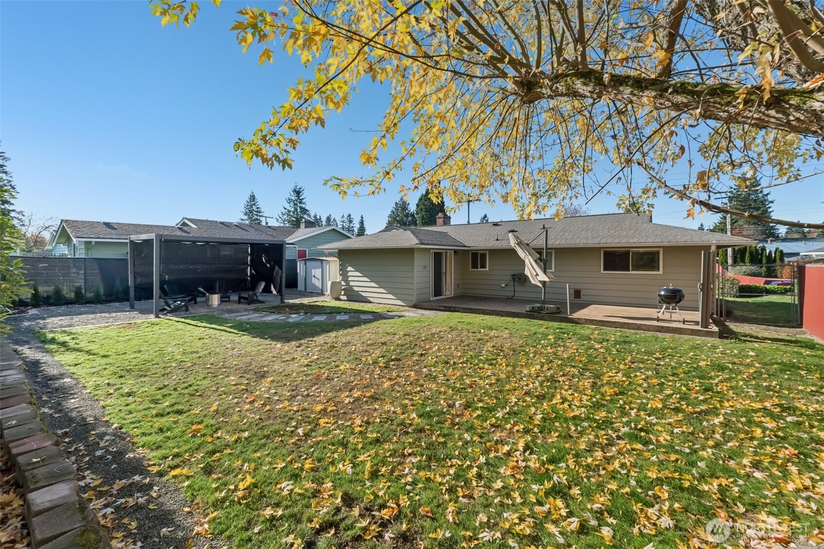 16602 126th Avenue Southeast Renton, WA 98058 - Photo 24 of 30 a view of a house with a large tree and a yard