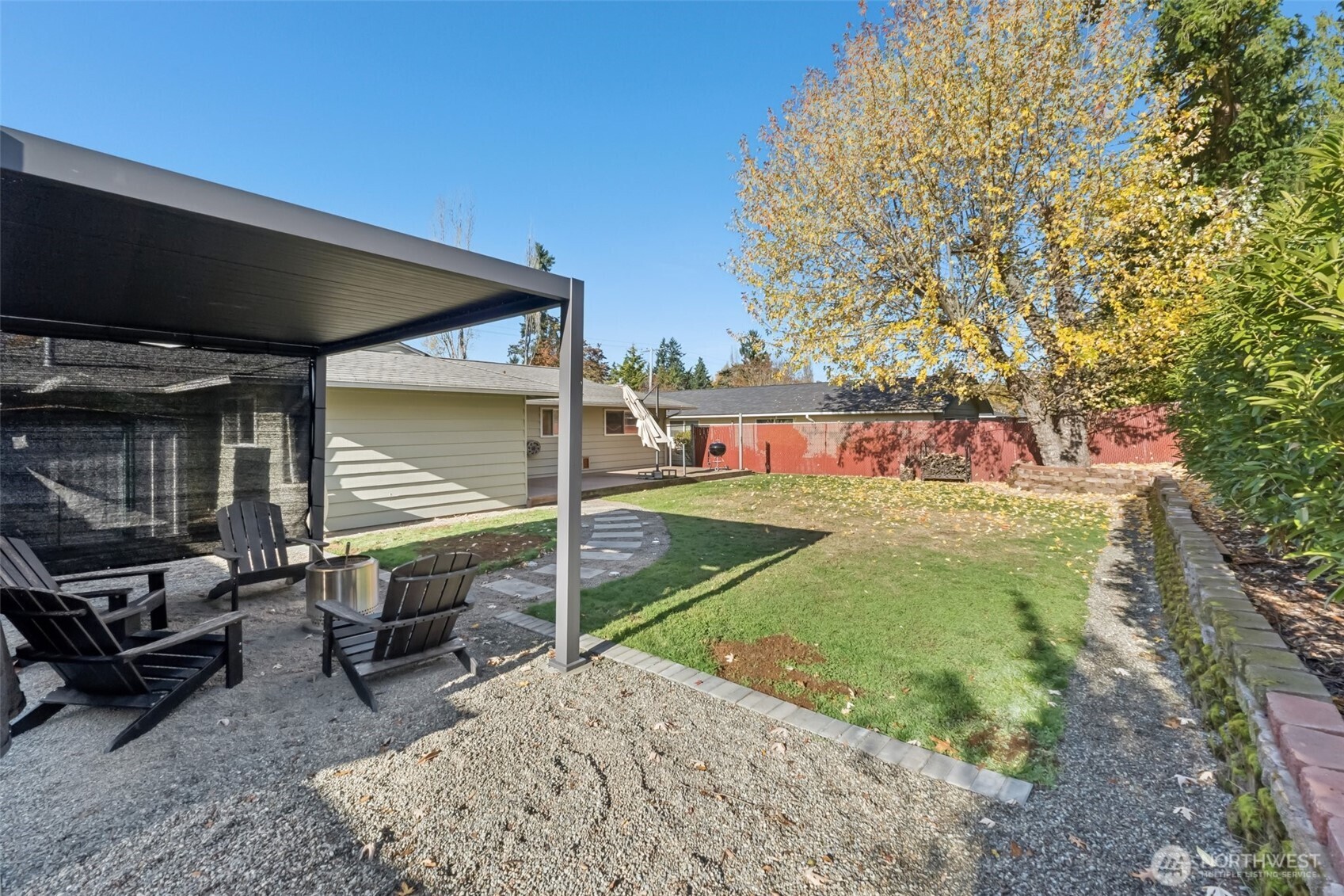 16602 126th Avenue Southeast Renton, WA 98058 - Photo 27 of 30 a view of a chairs and table in the patio