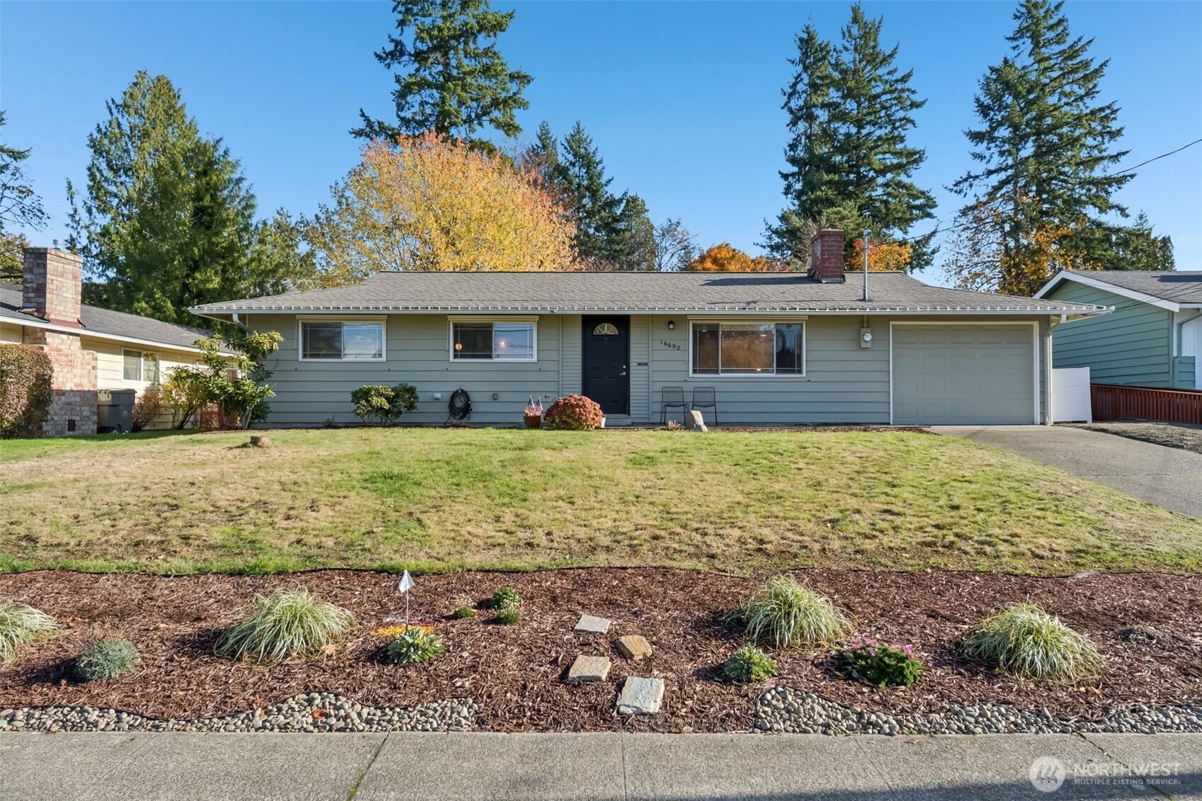 16602 126th Avenue Southeast Renton, WA 98058 - Photo 29 of 30 a front view of a house with garden