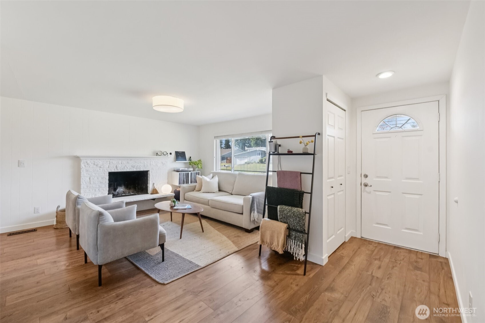 16602 126th Avenue Southeast Renton, WA 98058 - Photo 3 of 30 a living room with furniture and a fireplace
