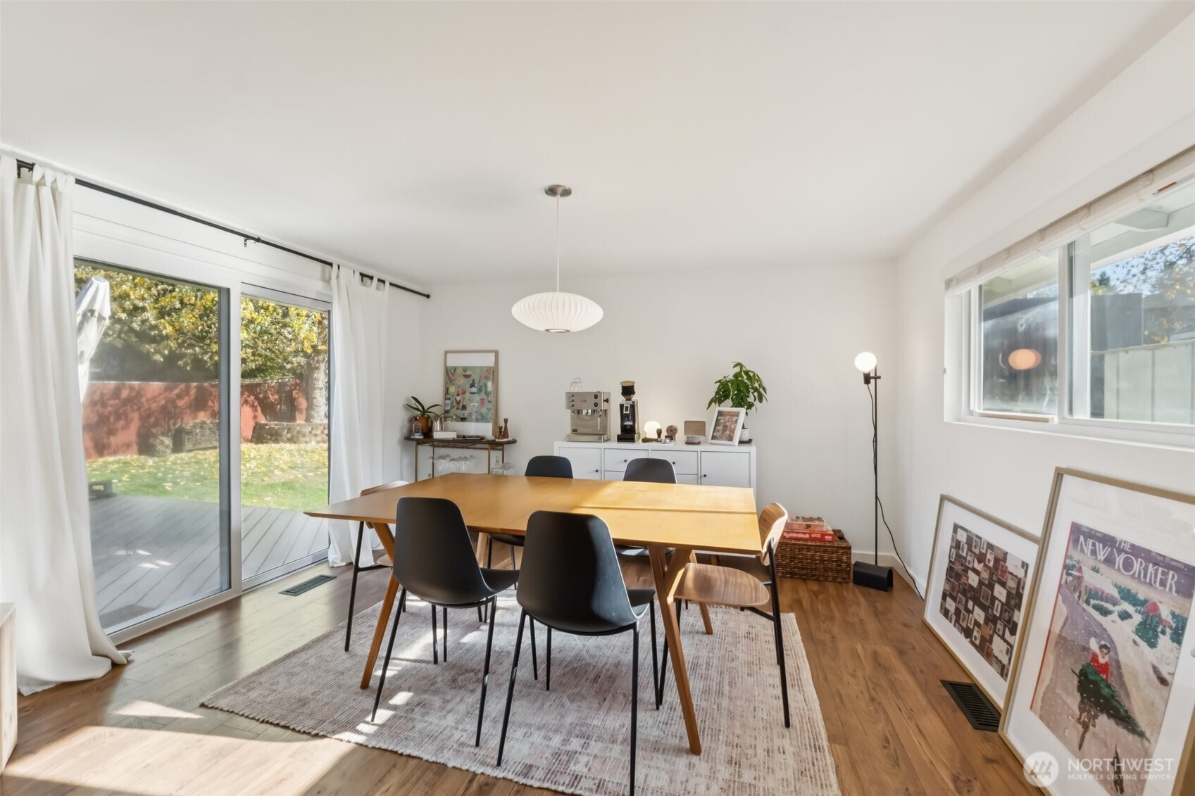 16602 126th Avenue Southeast Renton, WA 98058 - Photo 5 of 30 a view of a dining room with furniture and wooden floor