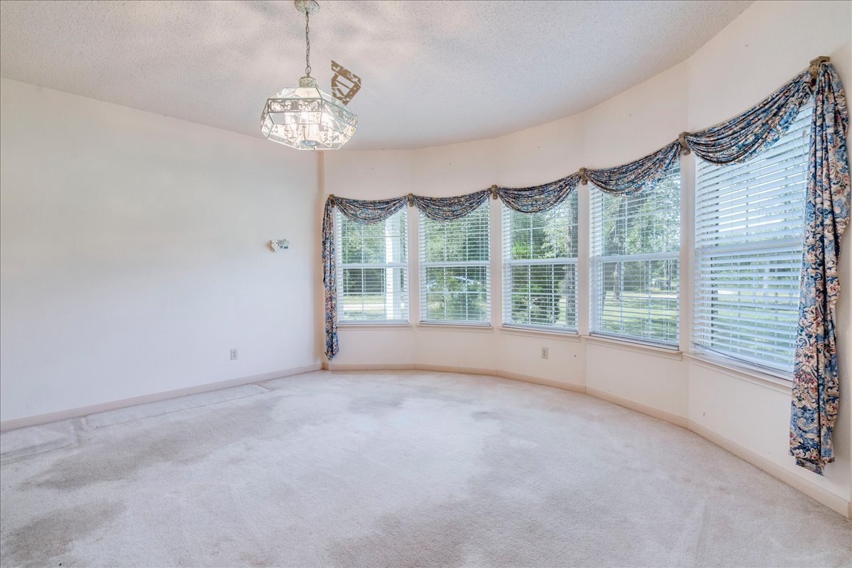 19106 Eyerley Road Manor, TX 78653 - Photo 12 of 40 Formal dining room set off of the kitchen