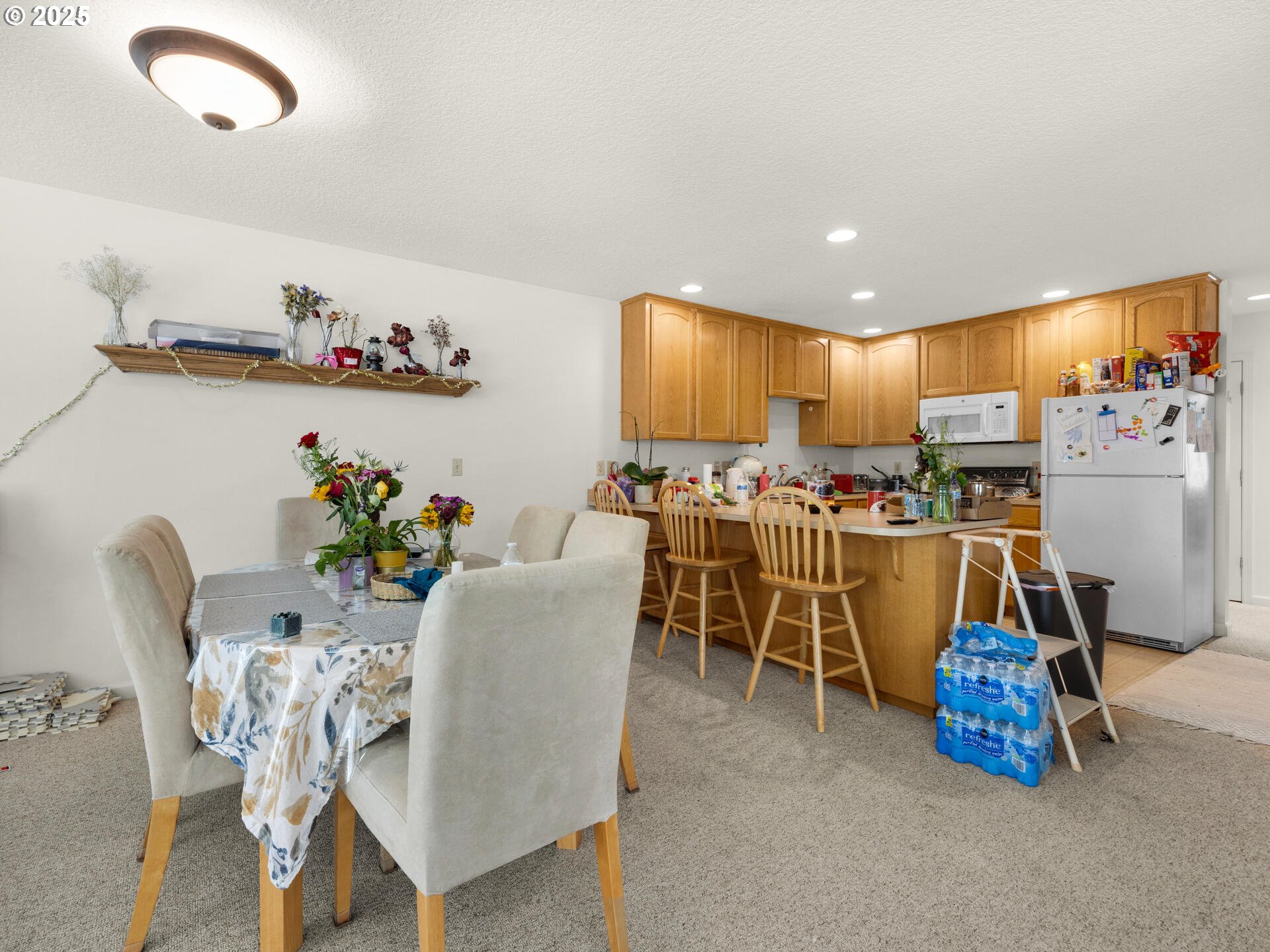 107 Sunset Boulevard Cannon Beach, OR 97110 - Photo 22 of 25 a dining room filled with furniture and a chandelier