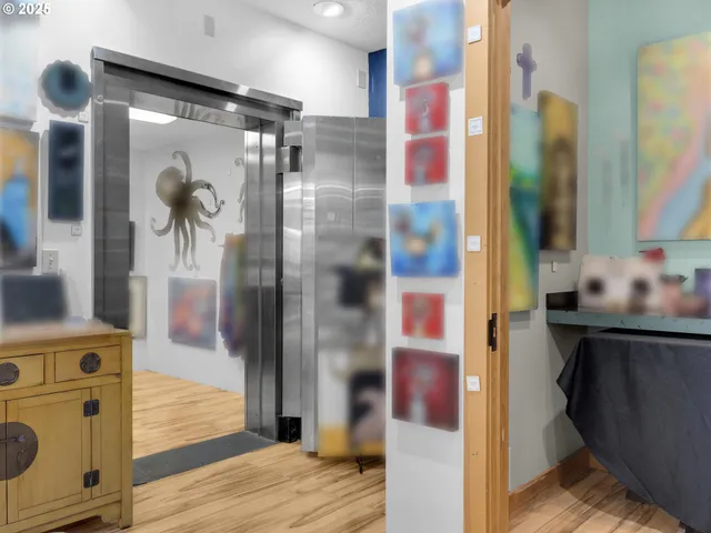 a bathroom with a glass door shower a sink and a mirror