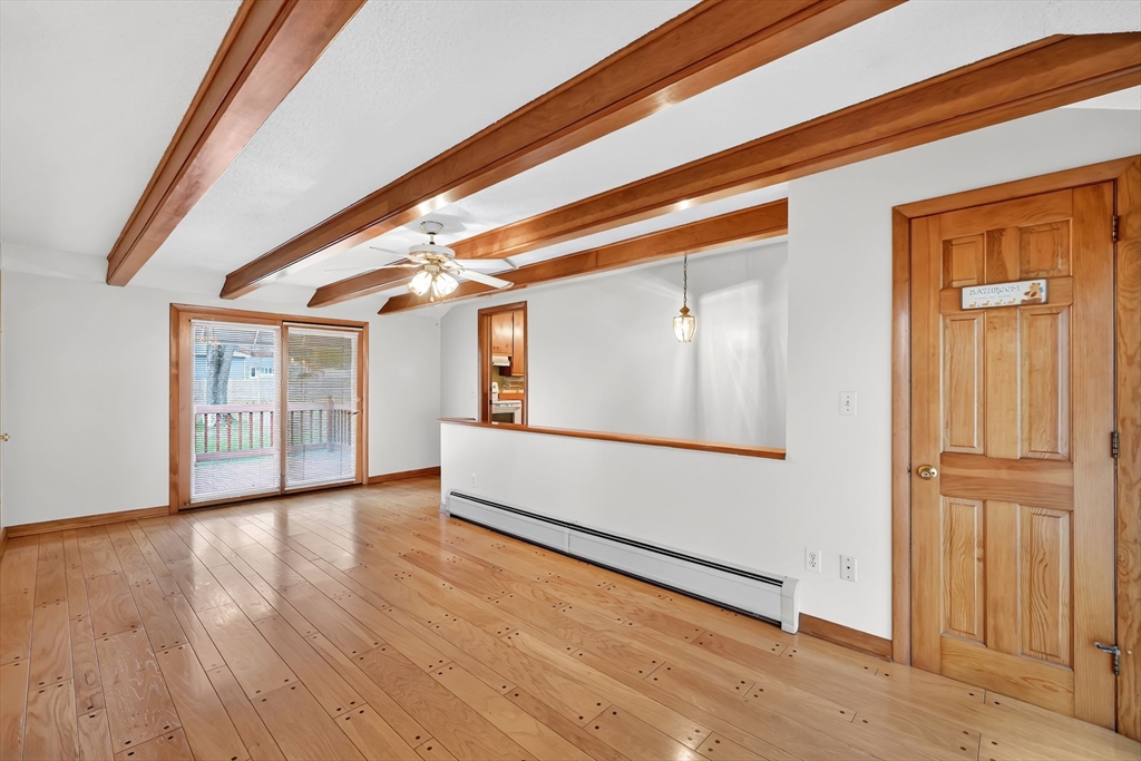 193 Marmon Street Springfield, MA 01129 - Photo 13 of 26 a view of a room with wooden floor and windows