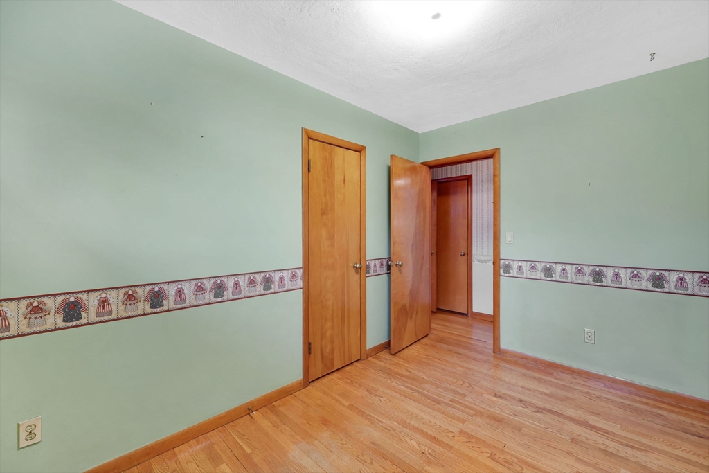 193 Marmon Street Springfield, MA 01129 - Photo 16 of 26 a view of empty room with wooden floor