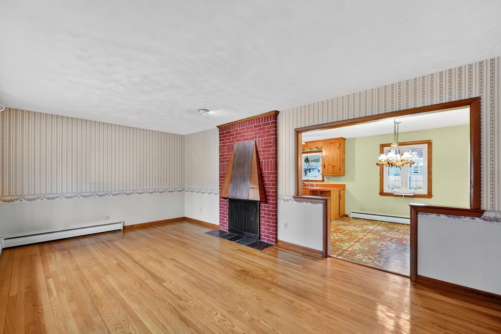 193 Marmon Street Springfield, MA 01129 - Photo 2 of 26 a view of empty room with wooden floor and fan