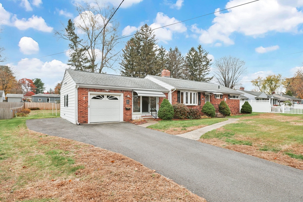 193 Marmon Street Springfield, MA 01129 - Photo 26 of 26 a front view of a house with a yard and garage