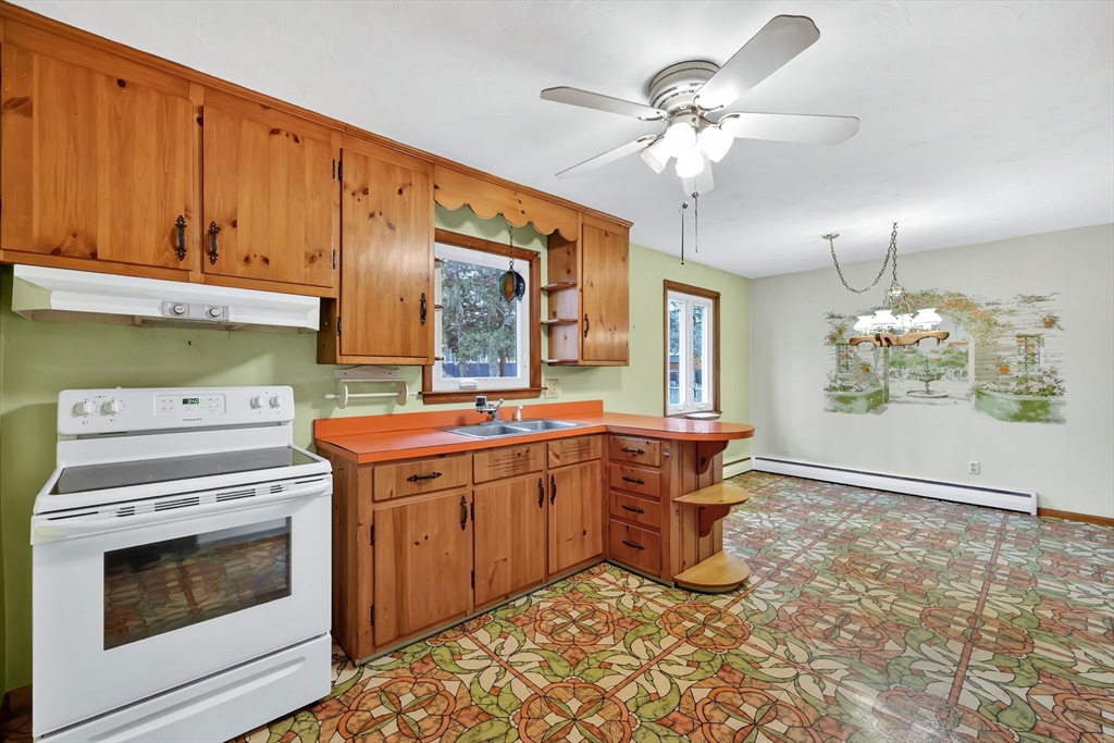 193 Marmon Street Springfield, MA 01129 - Photo 9 of 26 a kitchen with a stove and cabinets