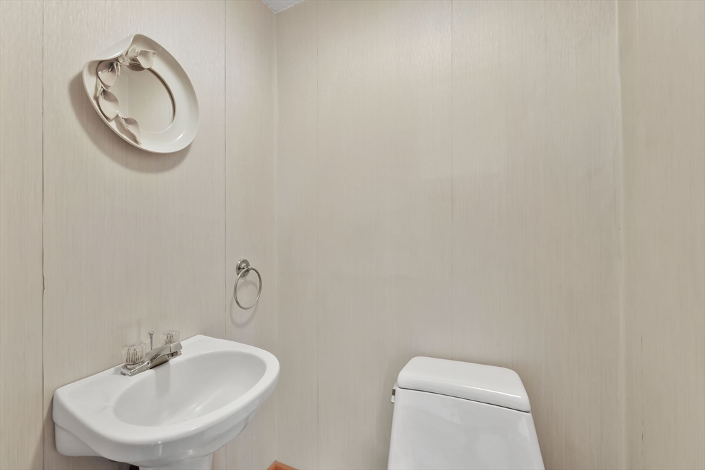 193 Marmon Street Springfield, MA 01129 - Photo 10 of 26 a bathroom with a toilet and a sink