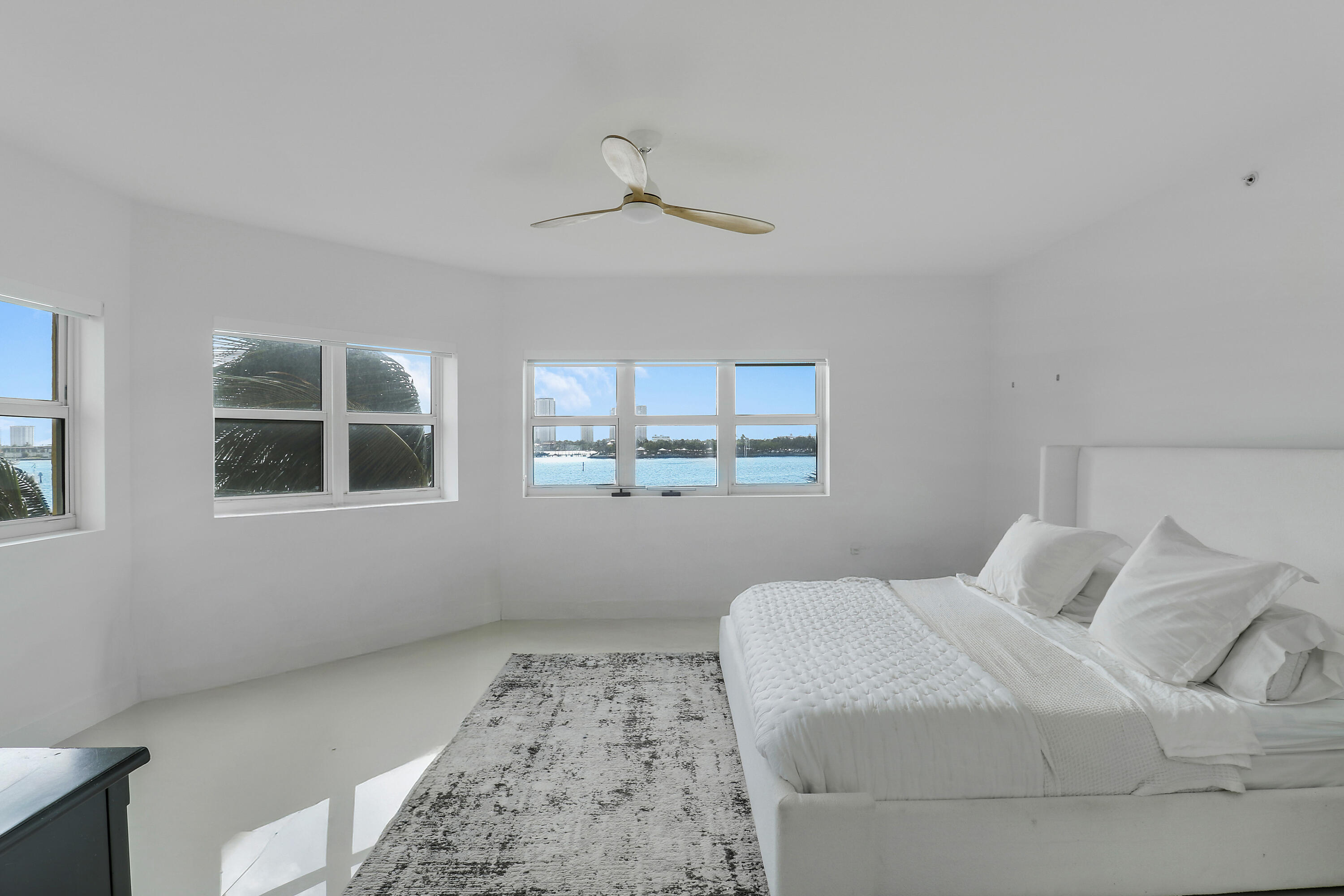 2640 Lake Shore Drive, Unit 307 Riviera Beach, FL 33404 - Photo 28 of 44 a bedroom with a bed and a window