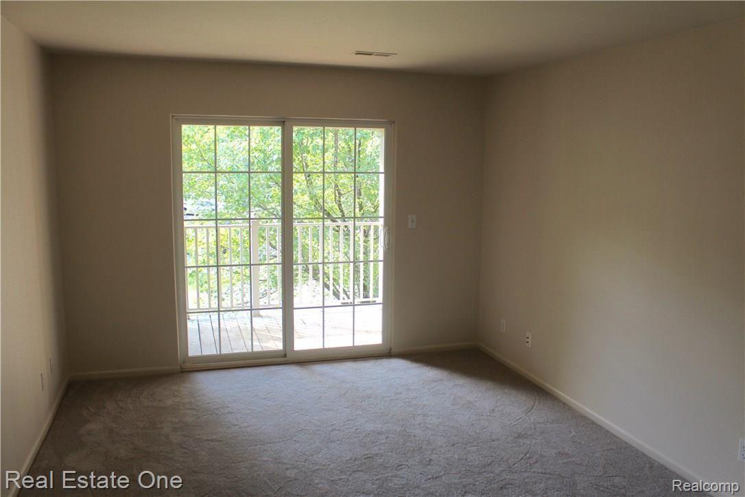 3512 Tremonte Cir Circle South, Unit 293 Rochester, MI 48306 - Photo 10 of 28 Master bedroom that opens to balcony