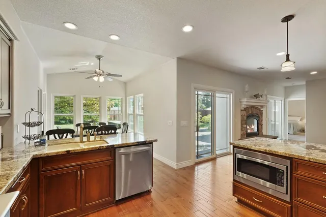 a view of a kitchen island a flat screen tv