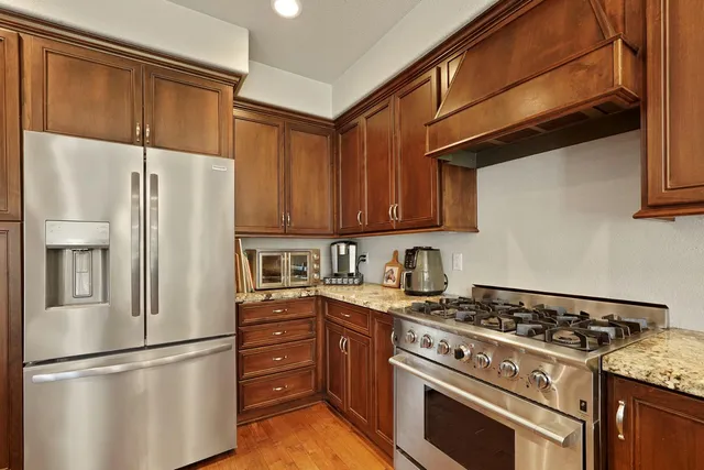 a kitchen with a stove microwave and refrigerator