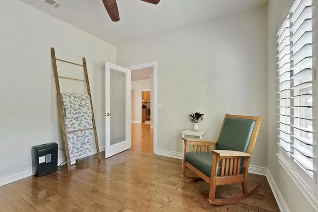 a view of room with furniture and wooden floor