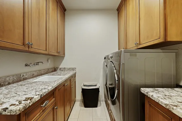 a view of a storage and utility room with a sink