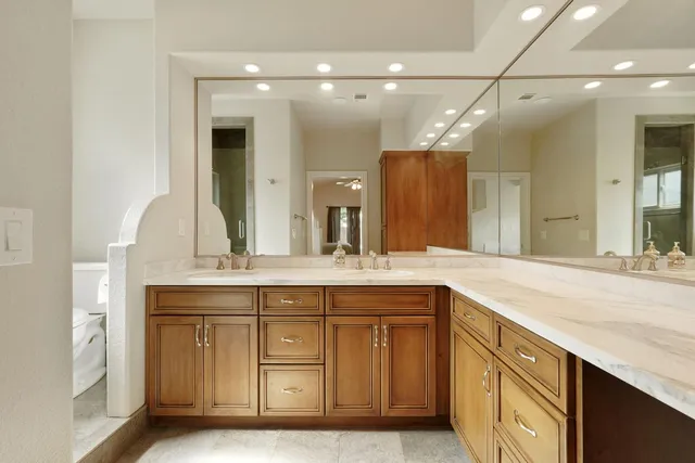 a bathroom with a sink vanity and a mirror