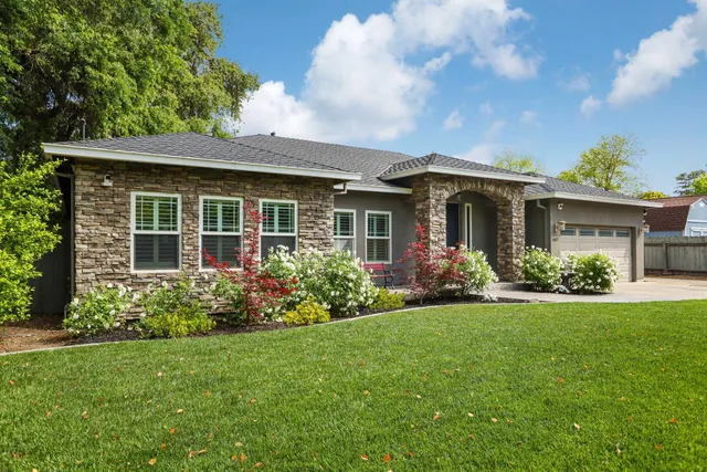 front view of a house with a yard