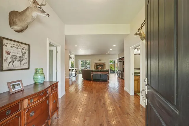 a view of a living room and a wooden floor