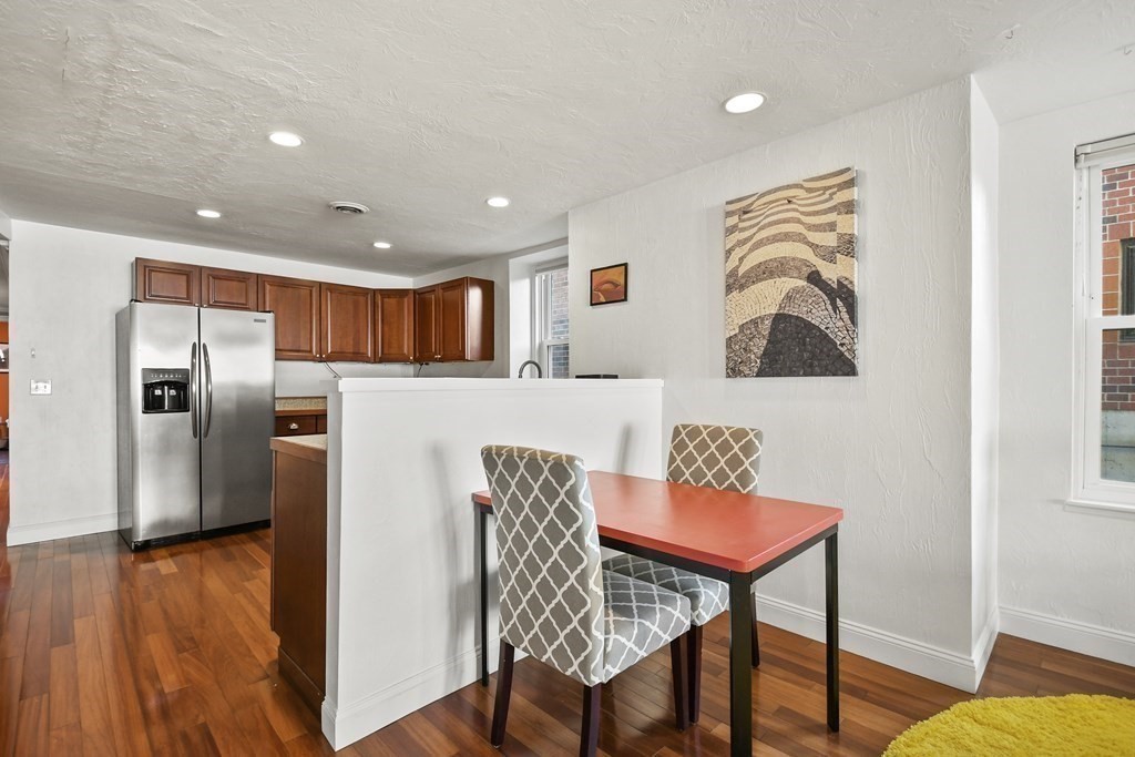 40 Elm Street, Unit 1 Worcester, MA 01609 - Photo 8 of 26 a dining room with furniture and wooden floor